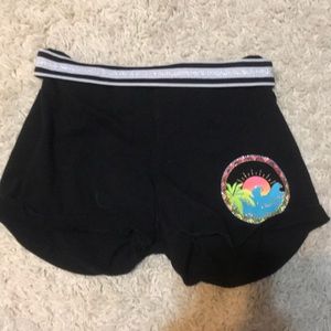 Black shorts with a white and black band